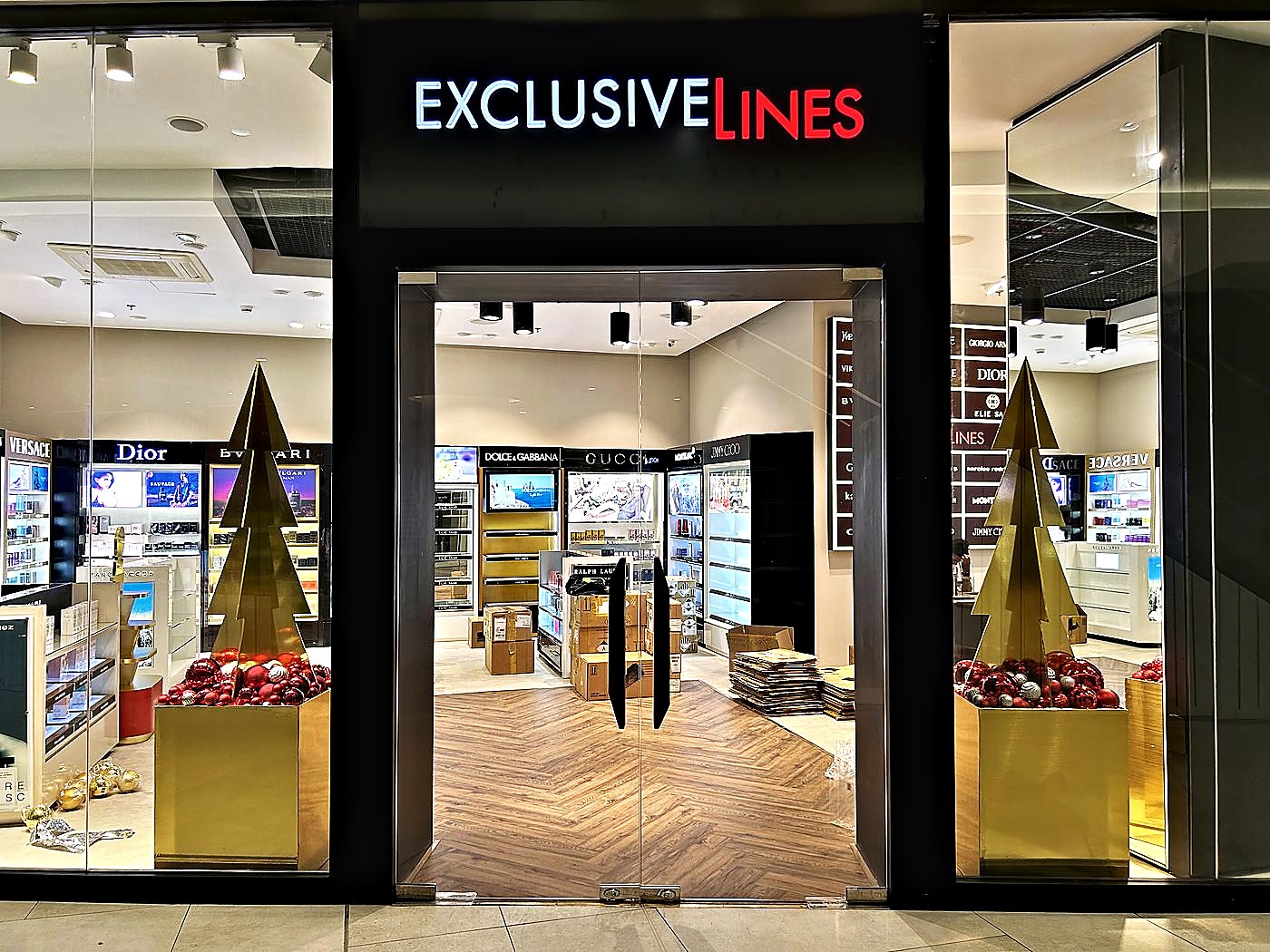 Gold trees framing a perfume store entrance